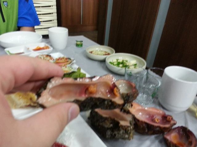 This is a seasquirt, severed and repurposed as a shot glass. It is beyond the abilities of mere men to overstate the delightfulness of such a thing. 